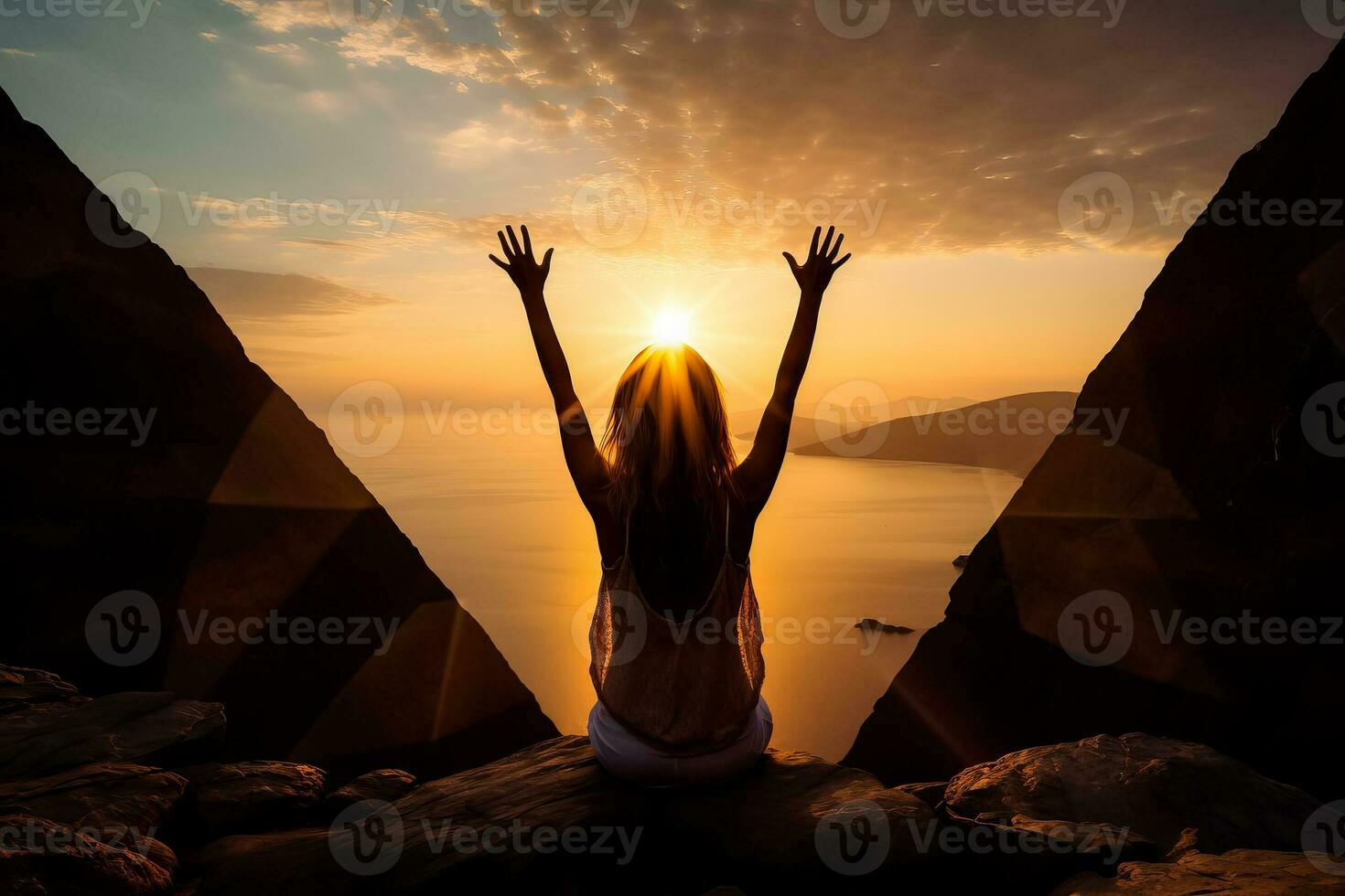 A woman creates a frame around the sun with her hands in the sunrise symbolizing future planning photo