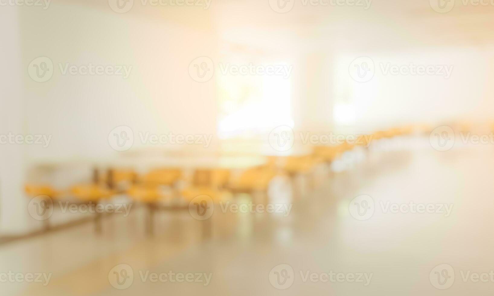 Blurred image background of empty seats and tables in the clean cafeteria or canteen photo