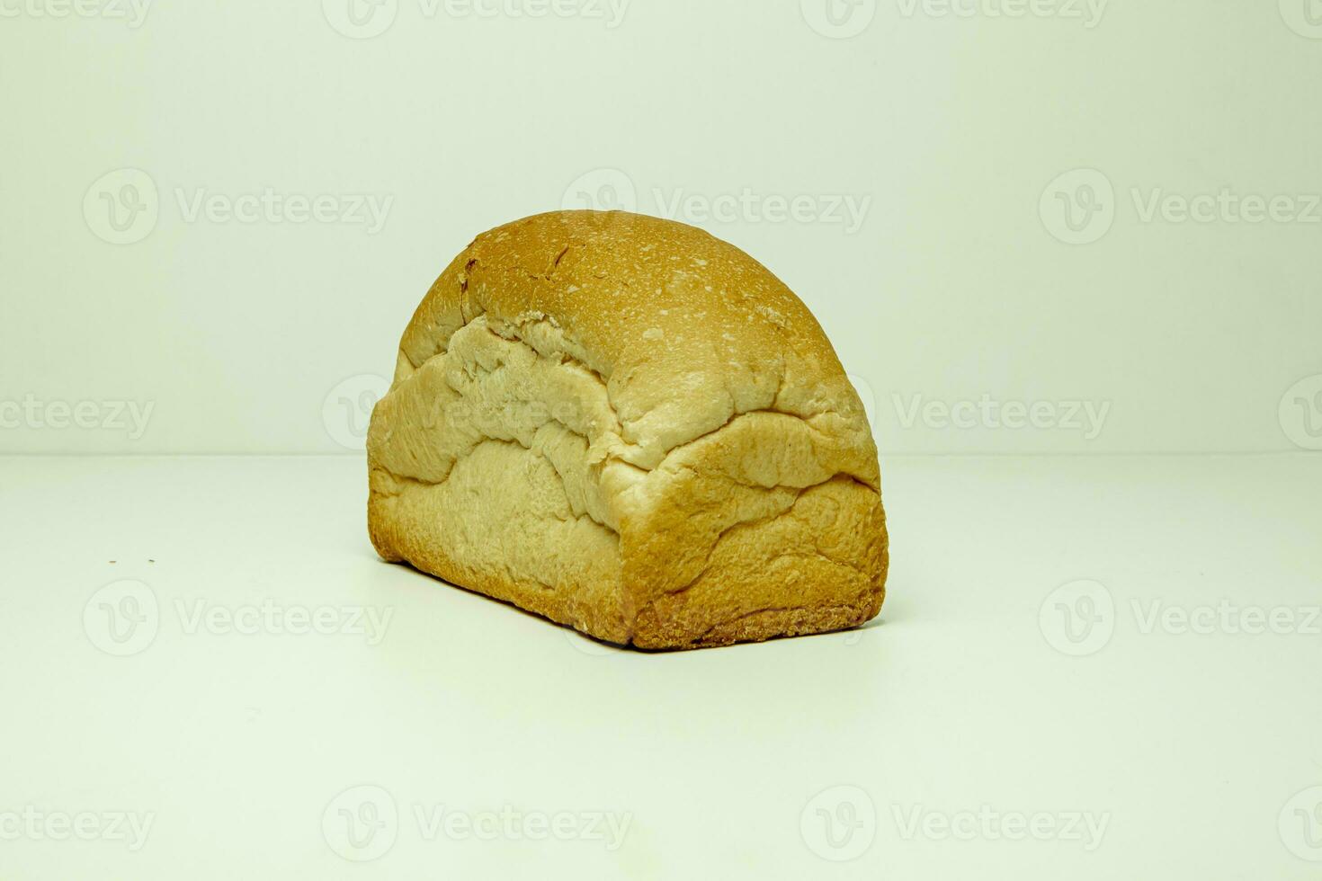 Loaf of bread isolated on a white background. Top view. photo