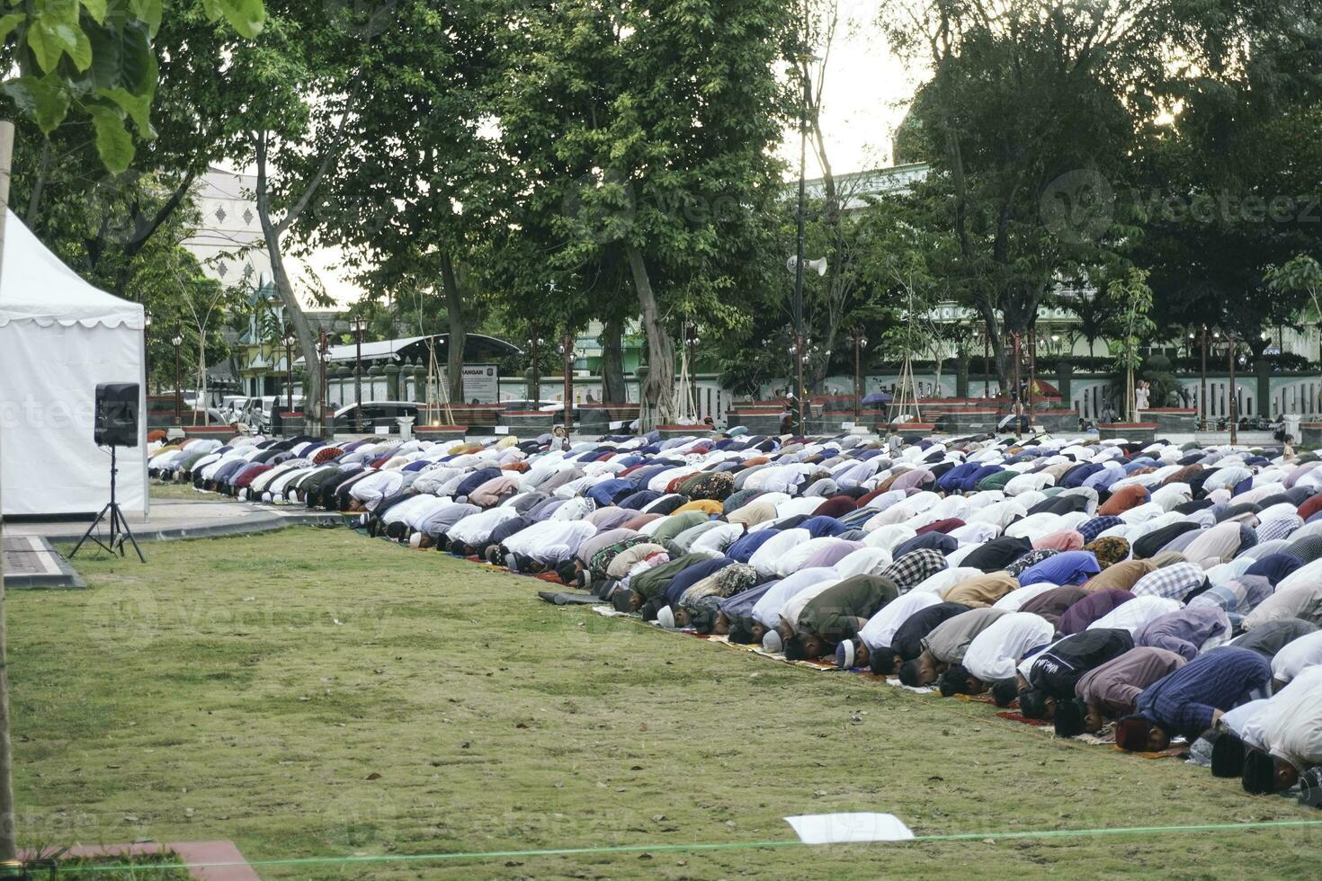 A photo of Muslim congregation praying Eid al-Adha in the field