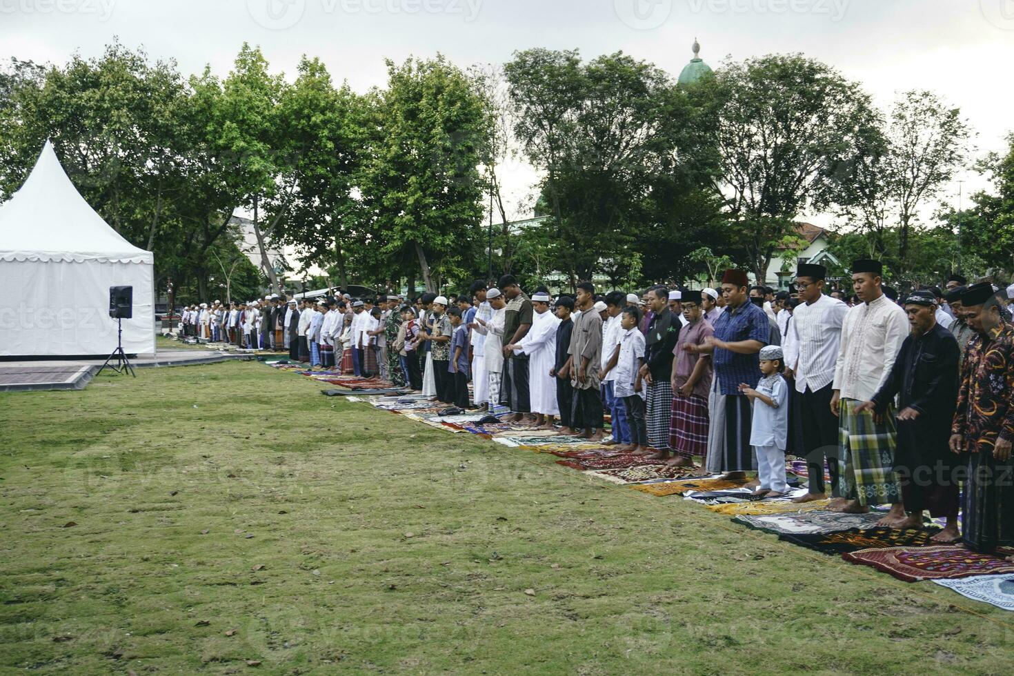 A photo of Muslim congregation praying Eid al-Adha in the field