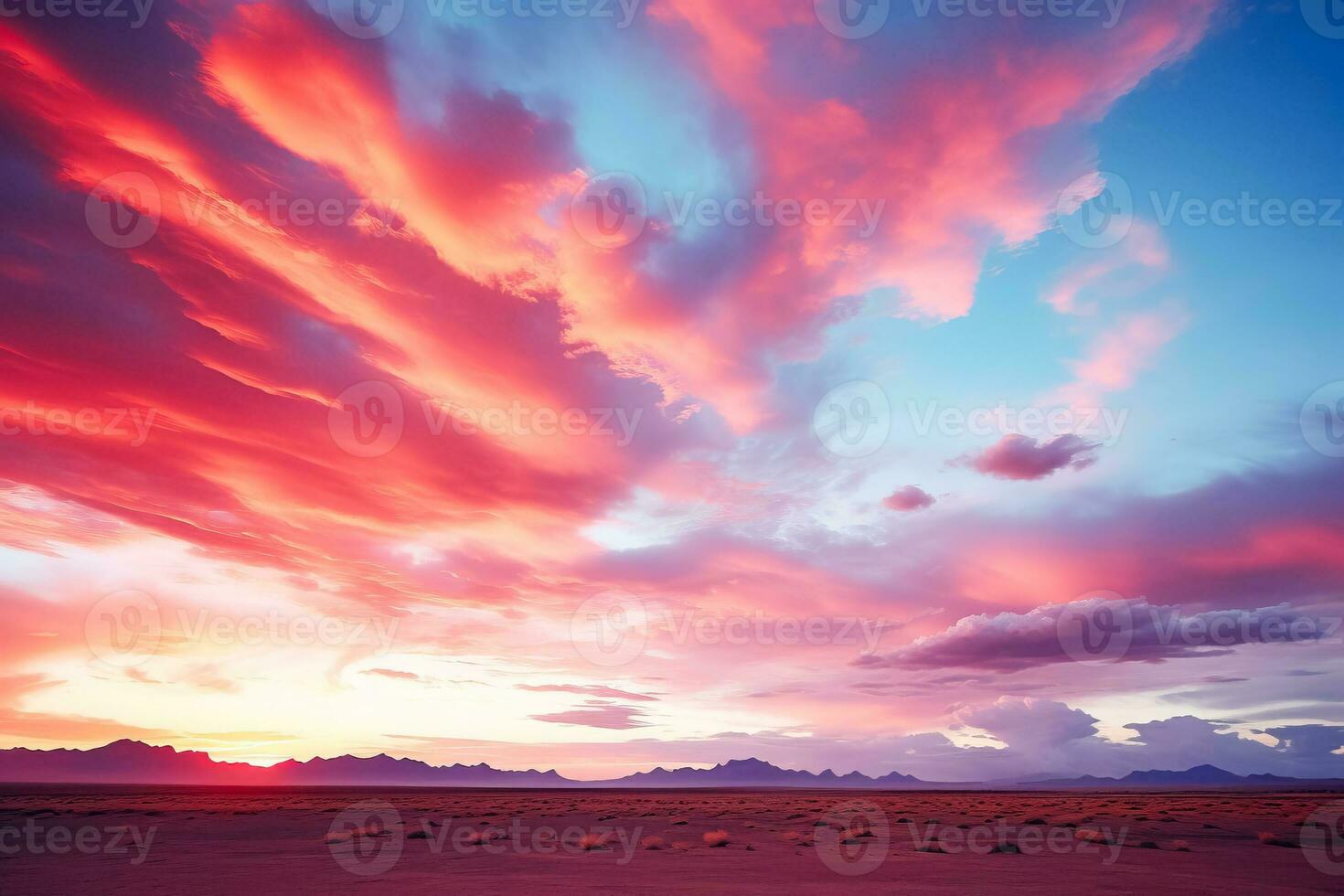 A stunning sunset illuminates rainbow clouds over vast desert landscapes with an expansive background for text placement photo