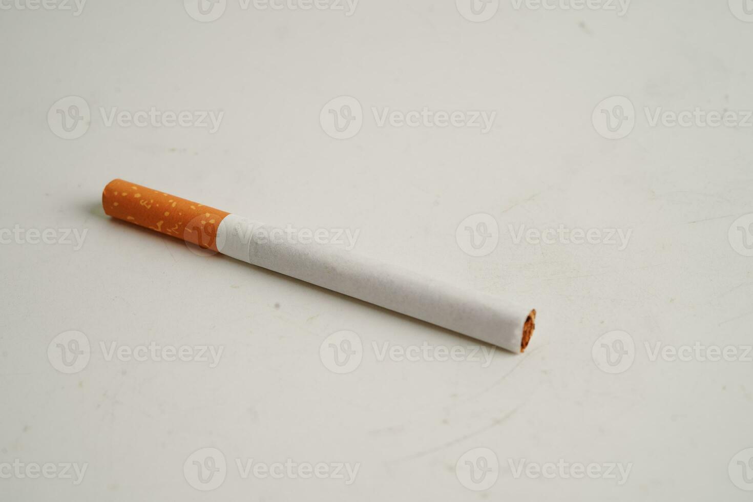 Cigarette isolated on white background with clipping path, roll tobacco in paper with filter tube, No smoking concept. photo