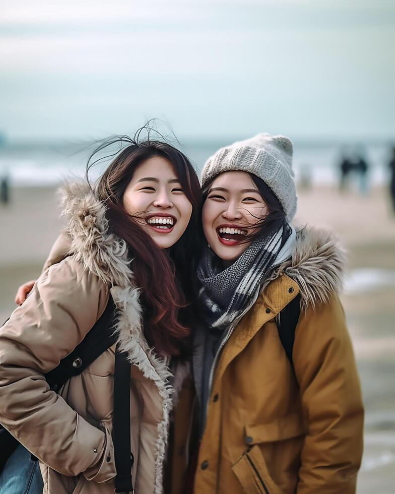 female best friend in winter dress on the beach photo
