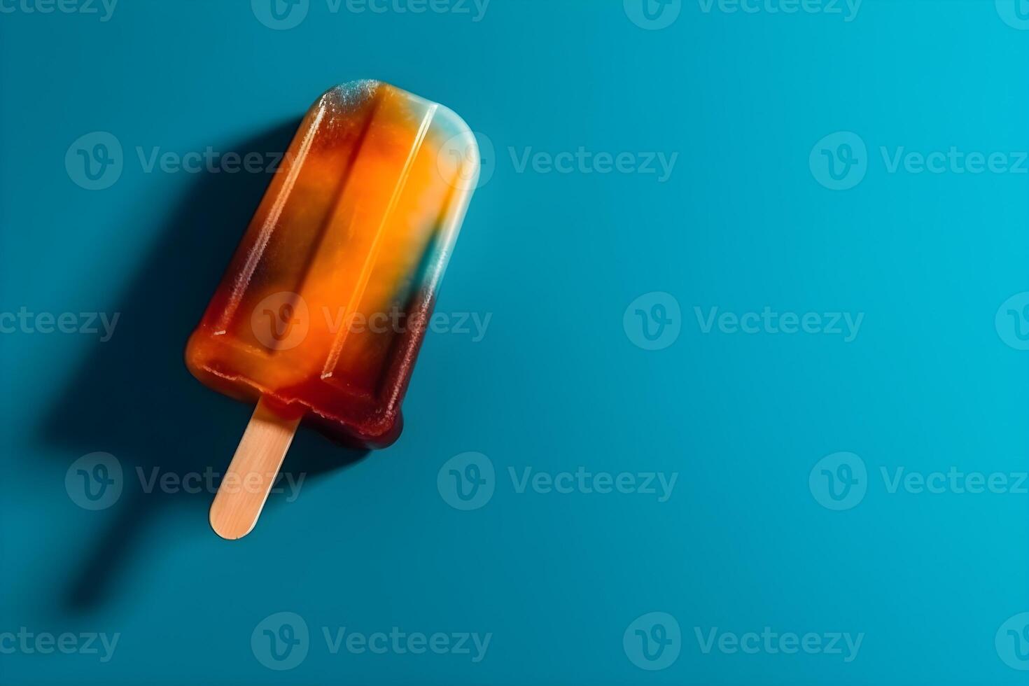 A colorful ice cream on blue background. photo
