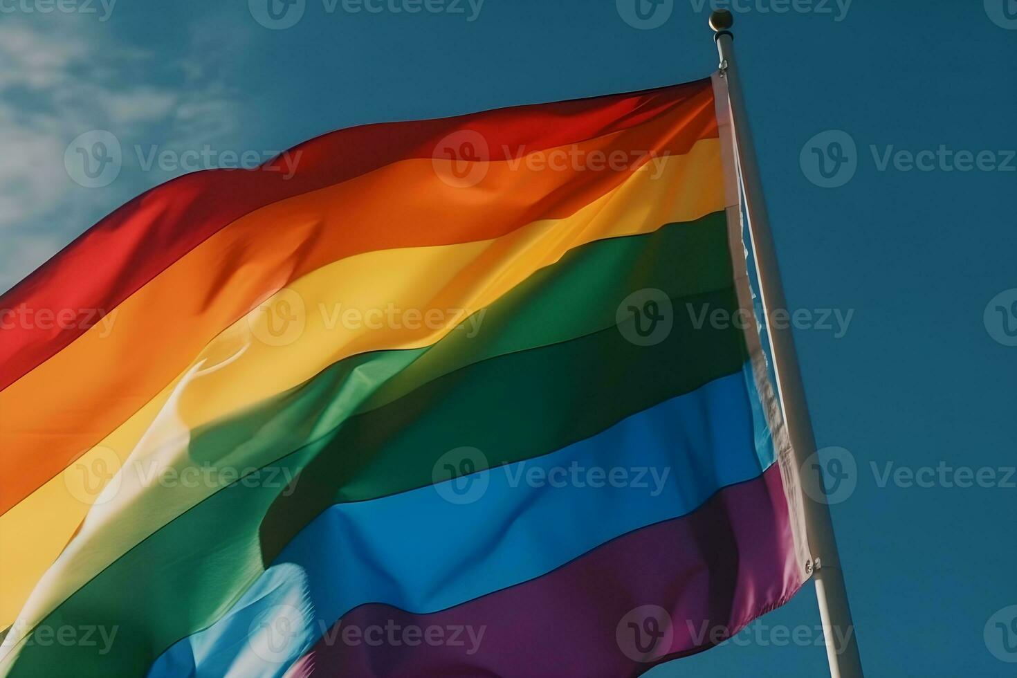 A rainbow flag waving in the wind photo