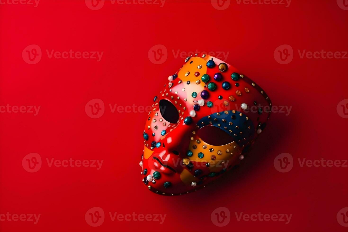 Beautiful carnival mask with feathers on red background with copyspace photo