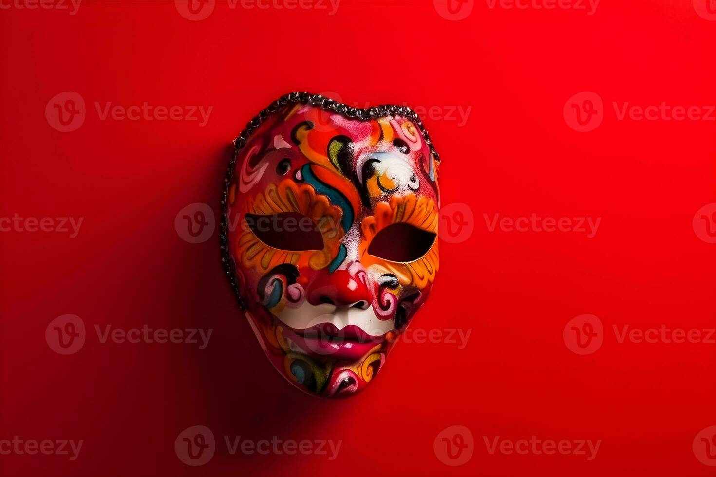 Beautiful carnival mask with feathers on red background with copyspace photo