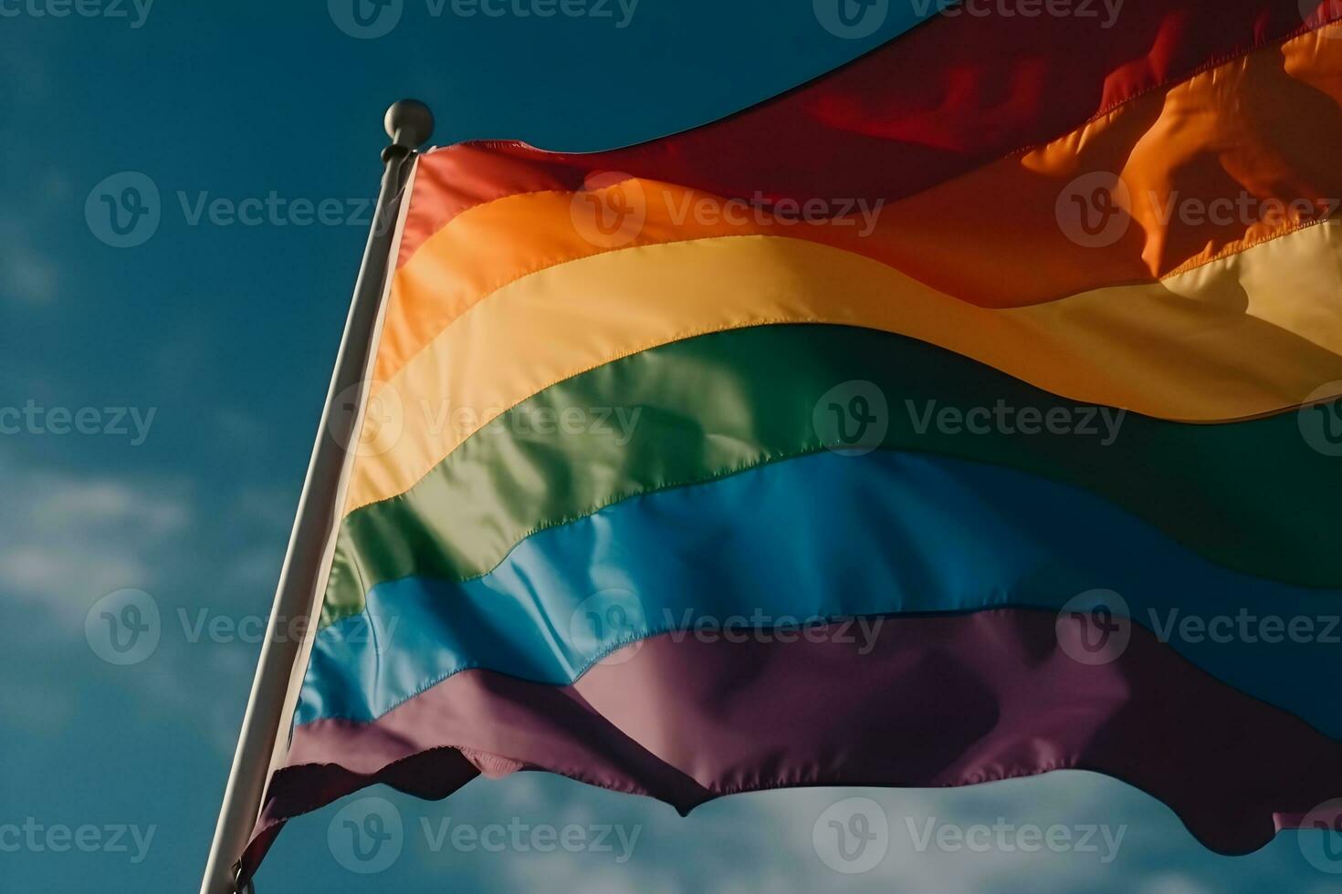 A rainbow flag waving in the wind photo