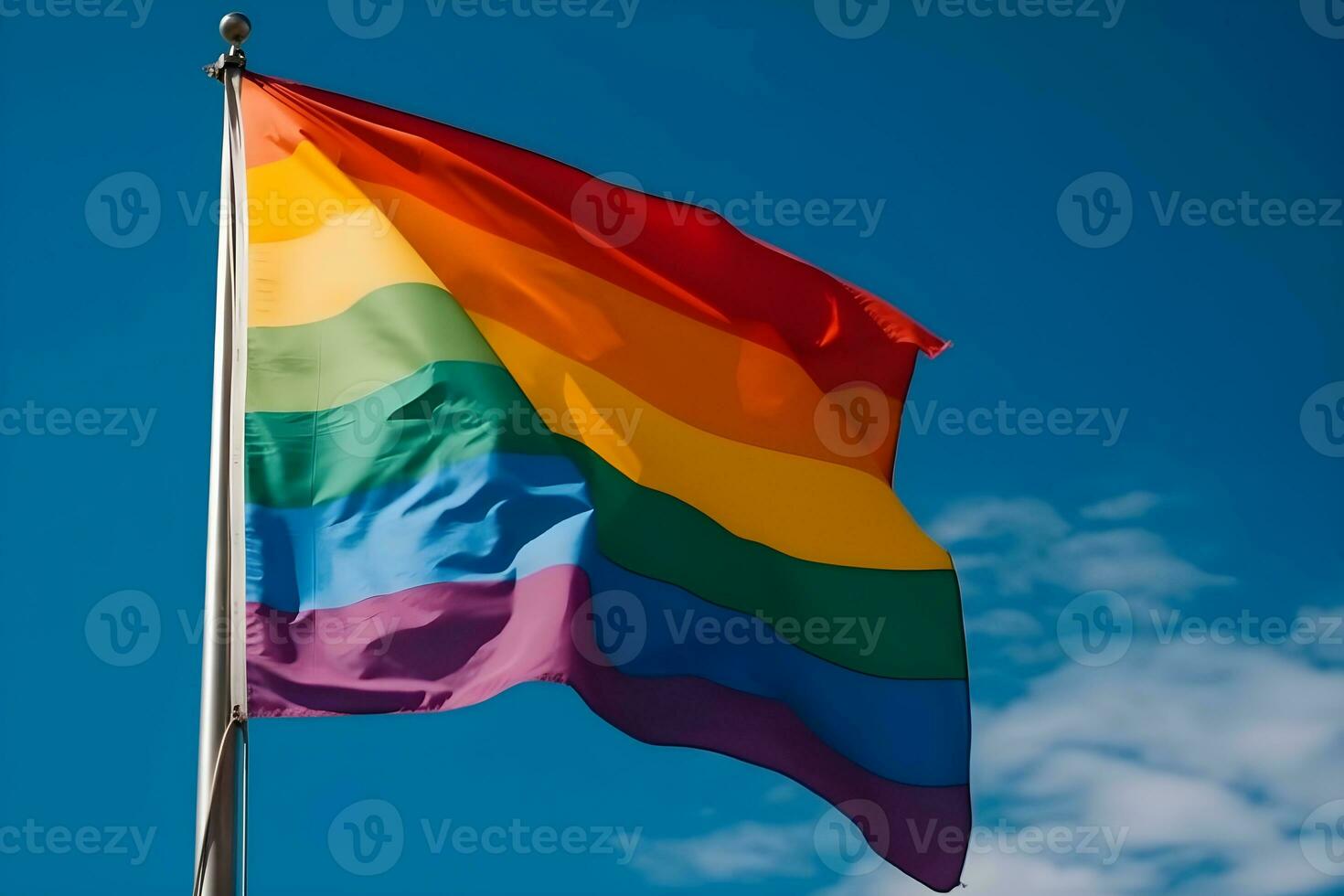 A rainbow flag waving in the wind photo
