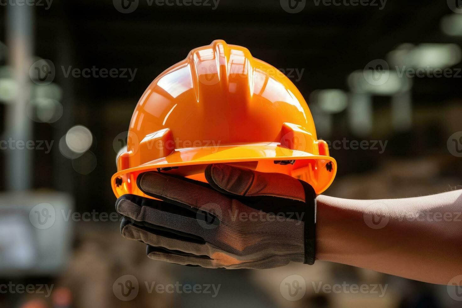 Human hand holding safety helmet photo