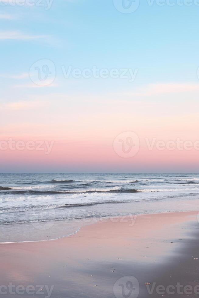 Tranquil beach scene at twilight with soft sunset colors blending into sky for ample copy space photo