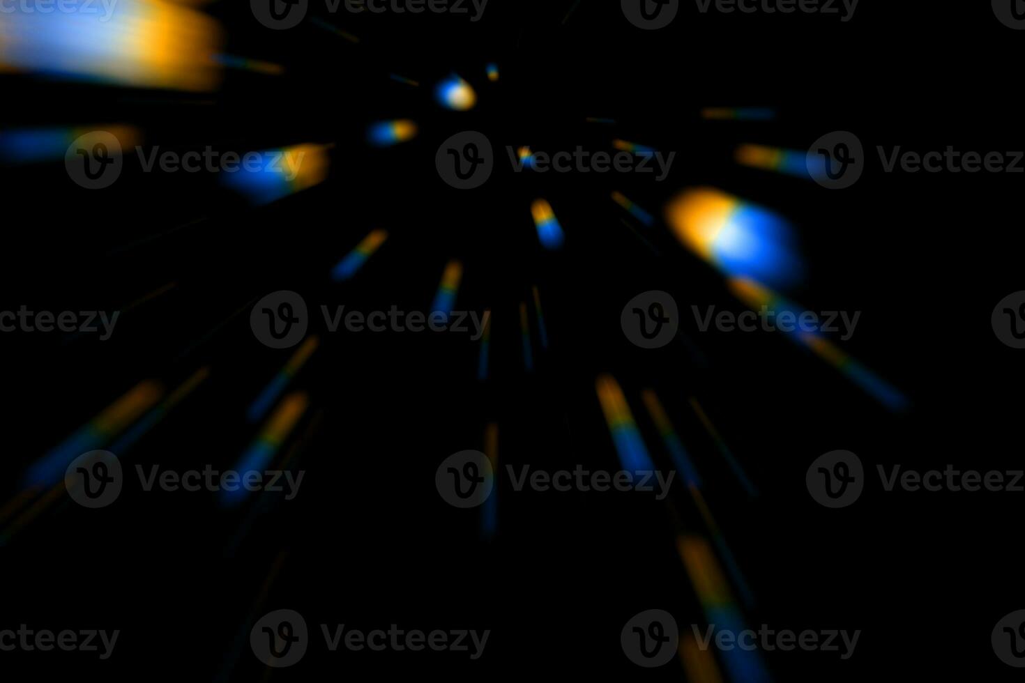 Flying colored optical spots on a black background. photo