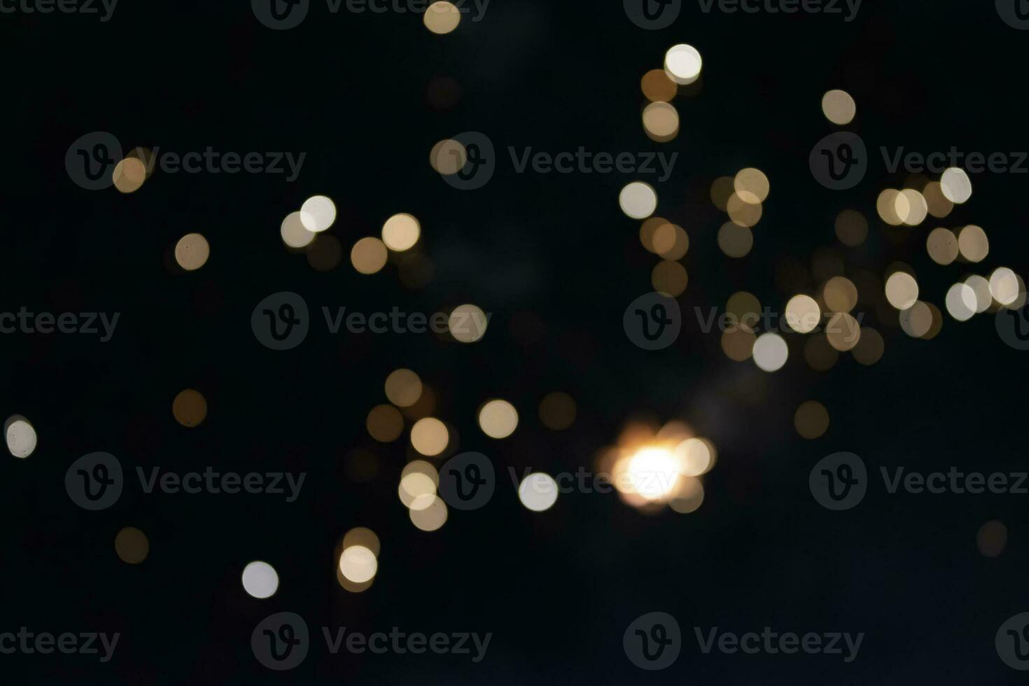 On a black background bokeh from explosions of colorful fireworks. photo