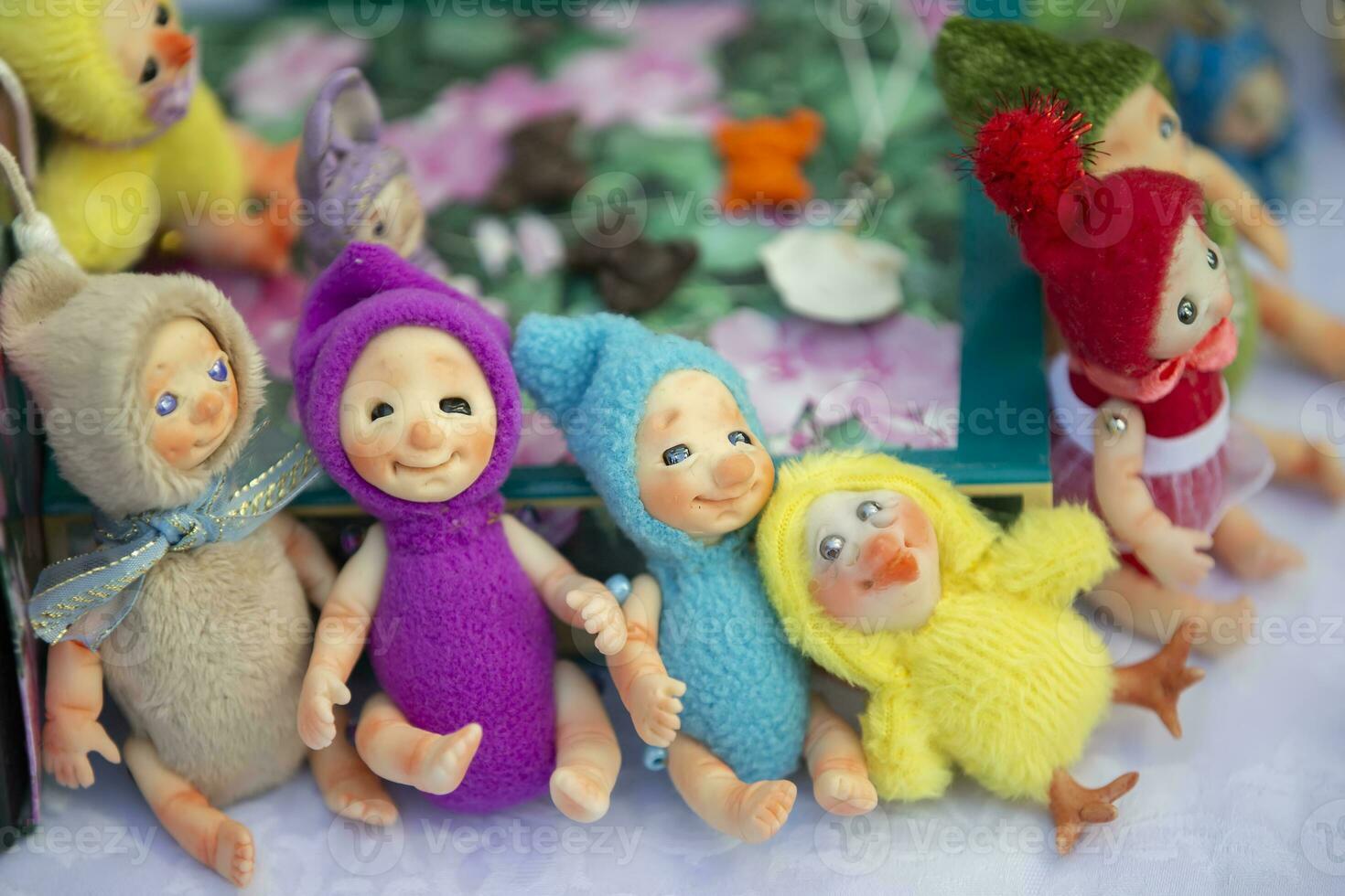 Funny multicolored handmade dwarf dolls. photo