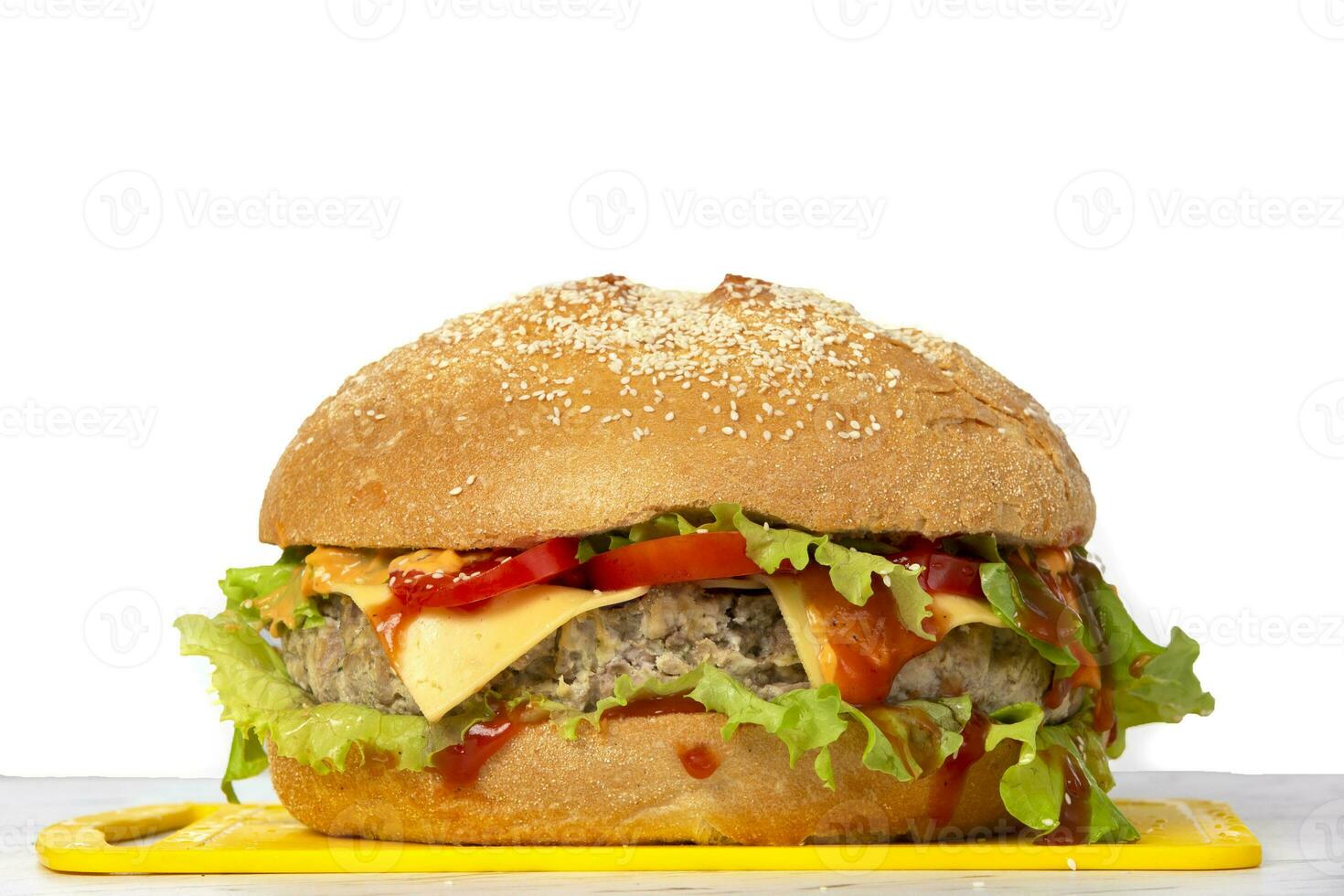 Big hamburger on a white background with copy space.Burger. photo