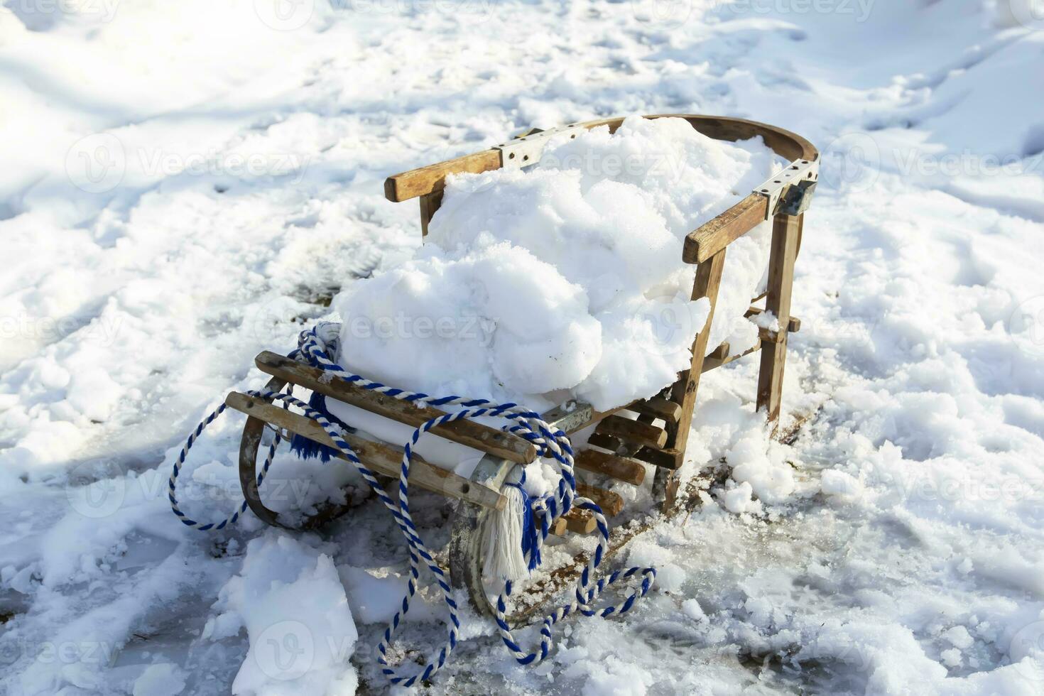 Wooden retro sled in the snow. photo