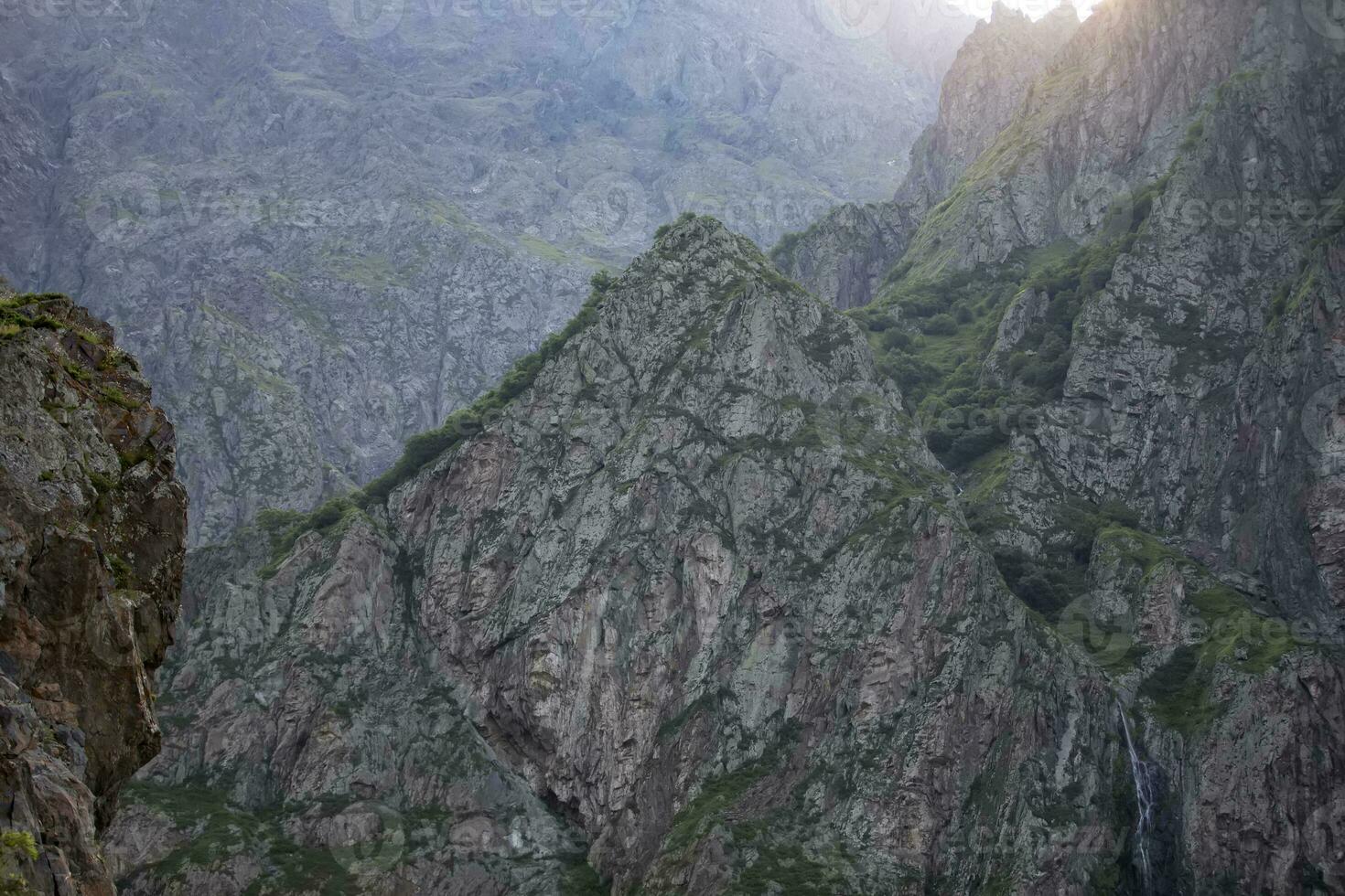 Rocky texture of highlands. Dark rocks. photo