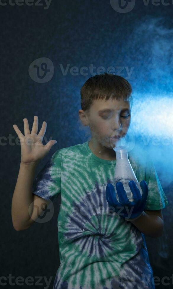 New scientific discoveries. Smart boy scientist screaming in surprise while doing chemical experiments in the laboratory. Education concept. Opening. photo