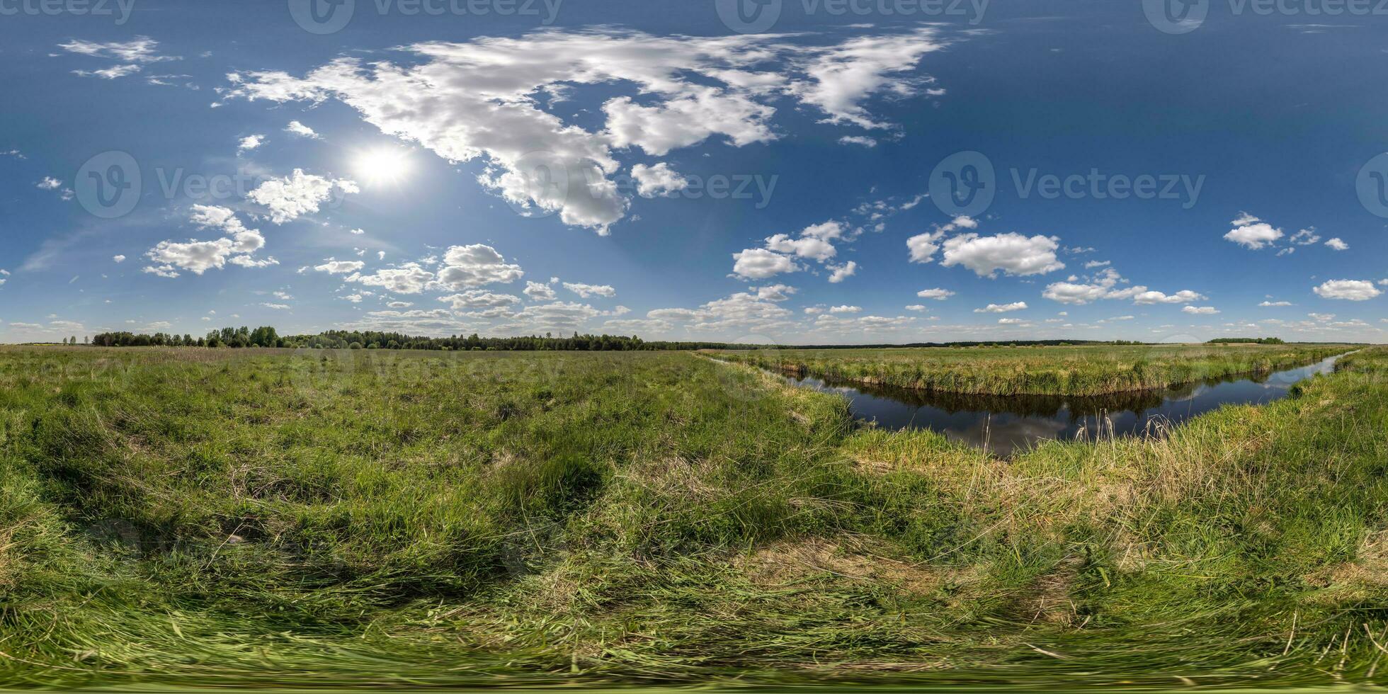 spherical 360 hdri panorama among green grass farming field near melioration reclamation canal in equirectangular seamless projection, as sky dome replacement, game development as skybox or VR content photo