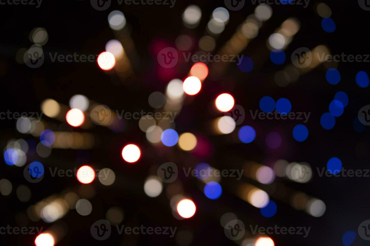 On a black background bokeh from explosions of colorful fireworks. photo