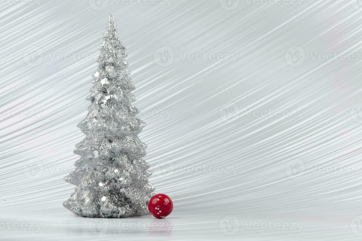 Christmas composition. Silver Christmas tree on a silver background. Happy Holidays. Minimal new year concept. photo