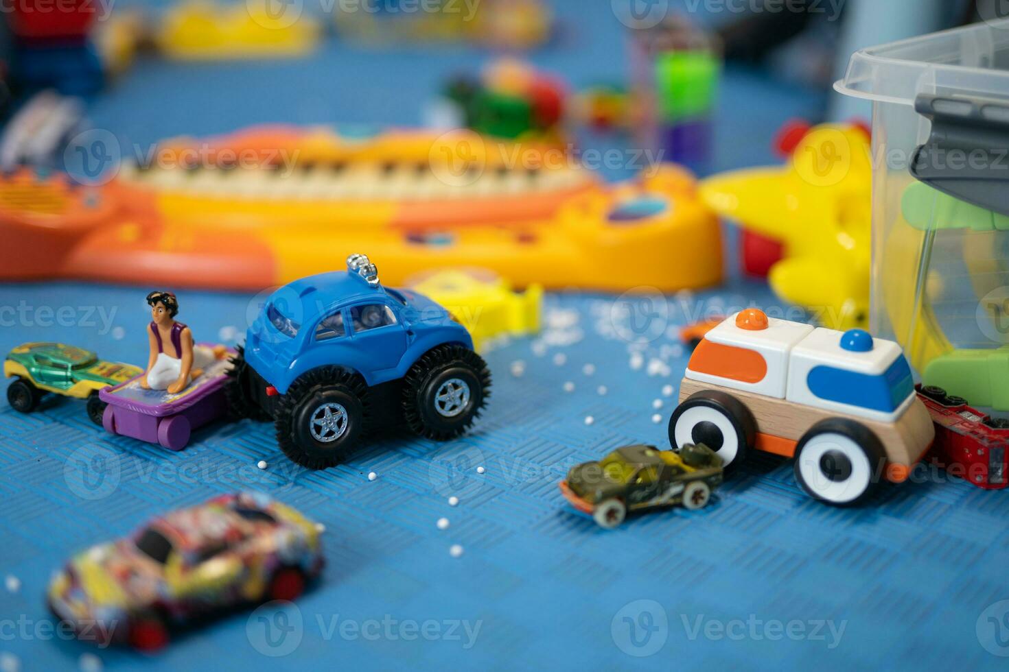 a small child plays with toy cars photo