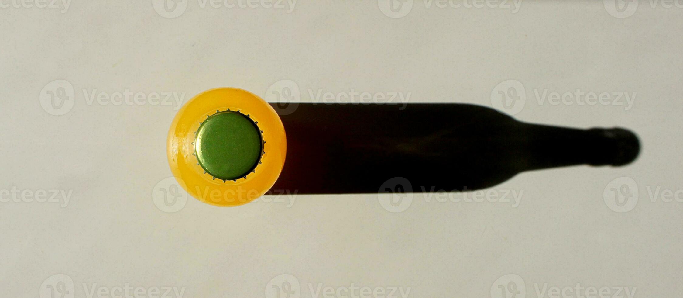 Lemonade glass Bottle with Metal stopper and a Shadow on table view from above. Closeup Flat lay Sunny Photography for Banner, Promotion, Ptinting, Poster. Fresh and juicy non-alcoholic Summer drink. photo
