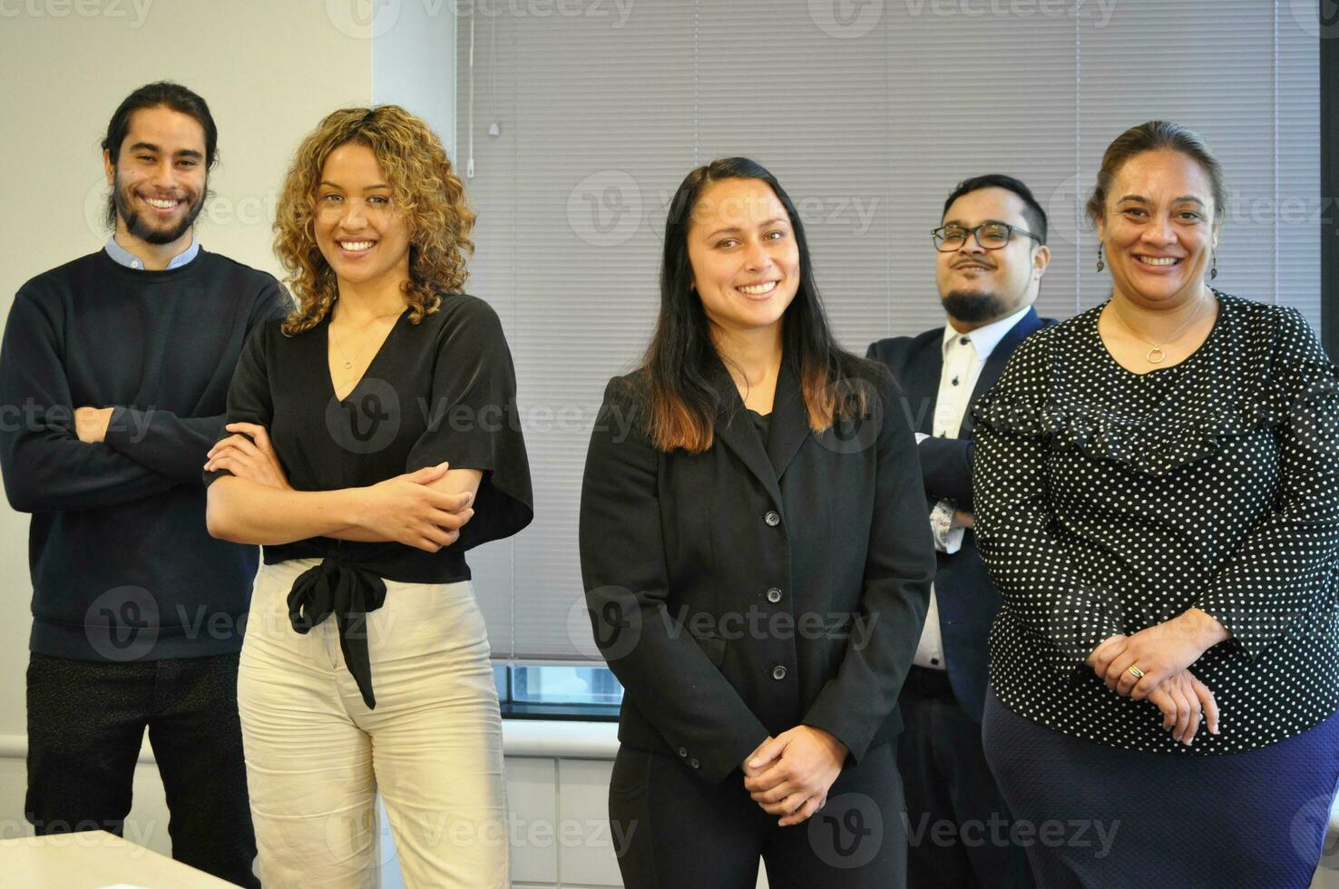 Maori, Pacific Islanders in business setting for meeting and coaching photo