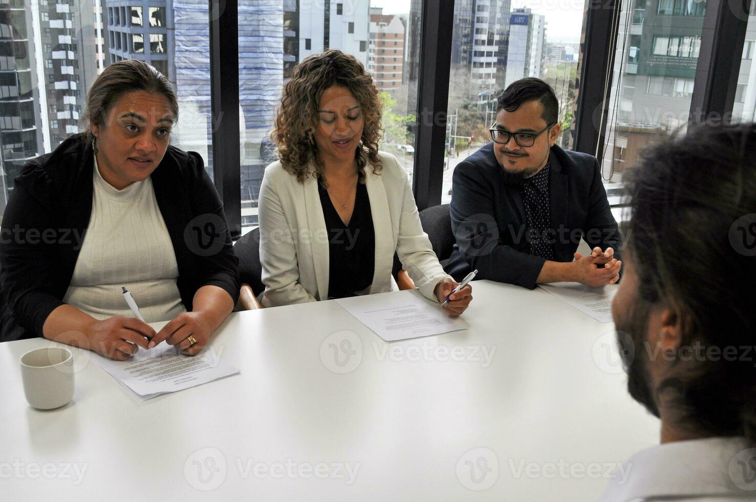 Maori, Pacific Islanders in business setting for meeting and coaching photo