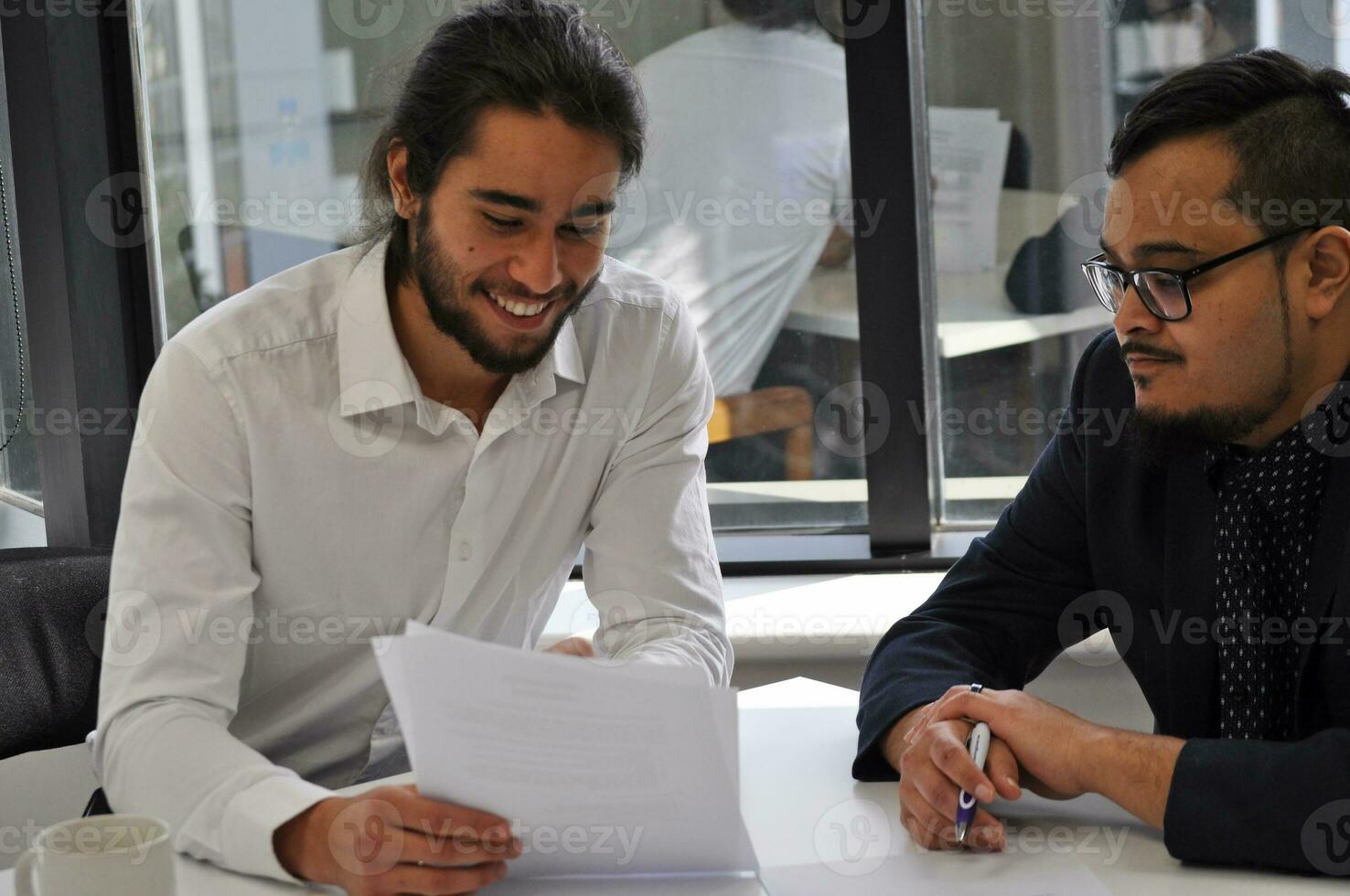 Maori, Pacific Islanders in business setting for meeting and coaching photo