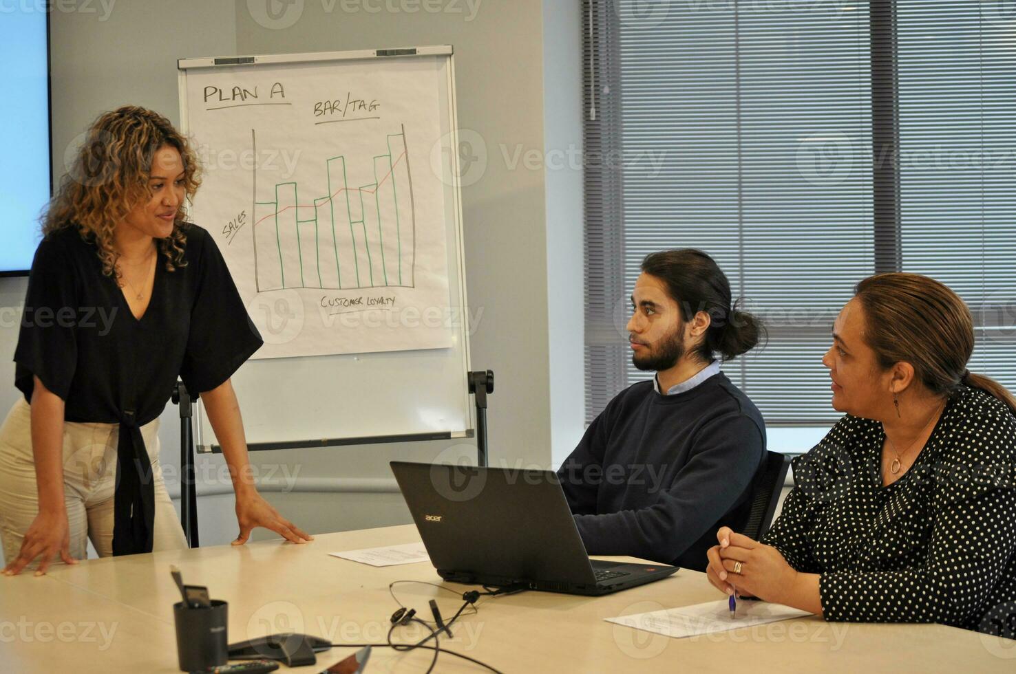 Maori, Pacific Islanders in business setting for meeting and coaching photo