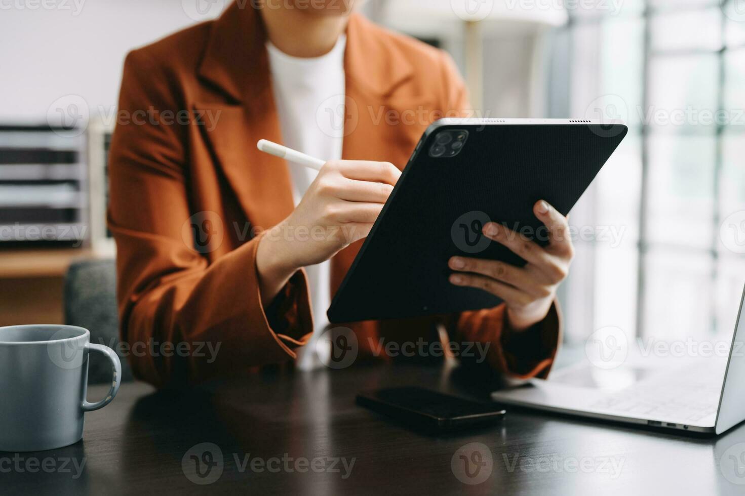 Bussinessman analyzing sales data and economic growth and pointing at business report document with graph chart financial chart marketing, banking and payments at modern office photo