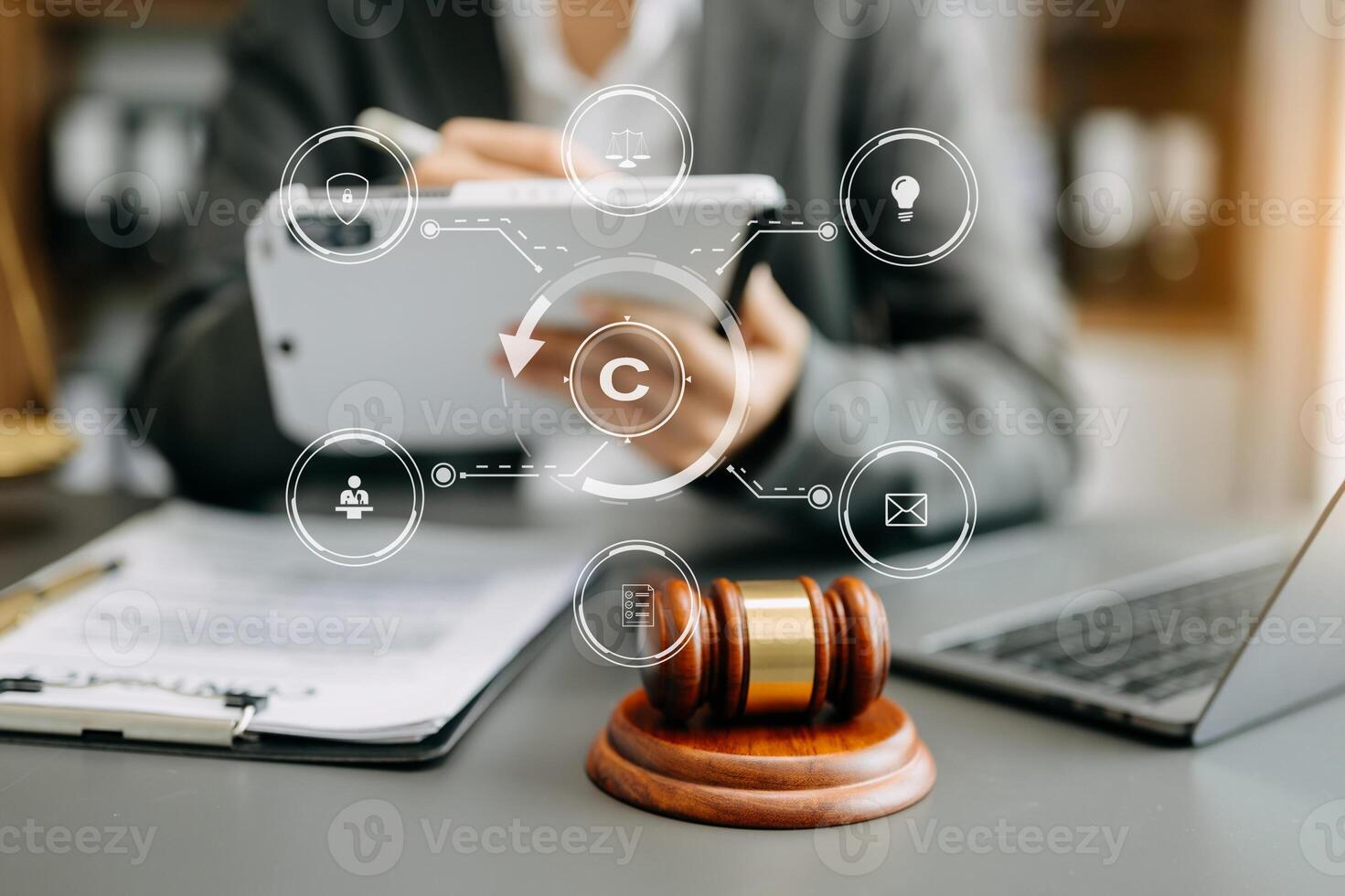 Copyright or patent concept, Person hand using laptop computer, tablet and smartphone with virtual screen copyright icon trademark, Creation ownership against piracy. photo