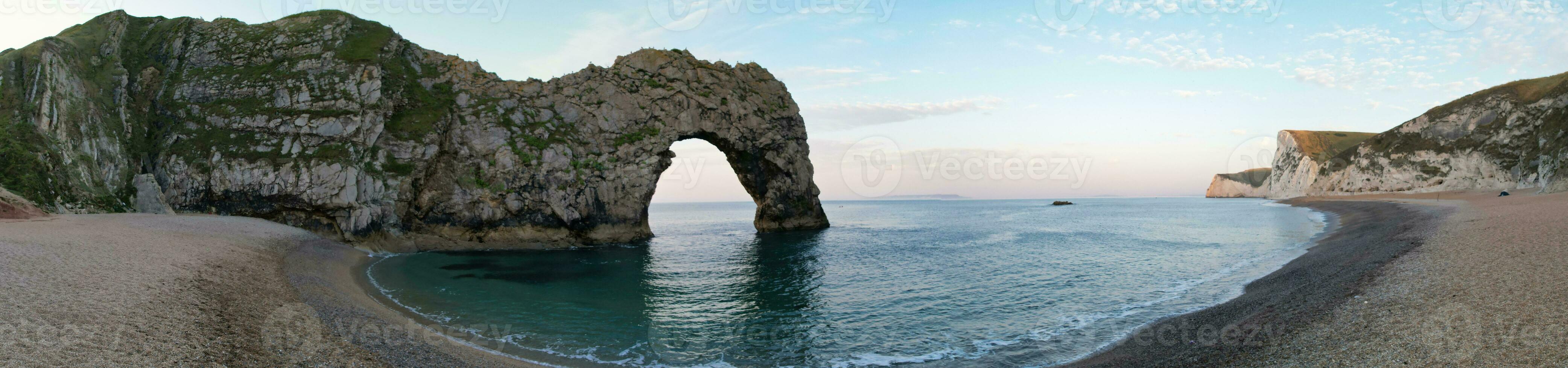 Most Beautiful High Angle View of British Landscape and Sea View of Durdle Door Beach of England Great Britain, UK. Image Was captured with Drone's camera on September 9th, 2023 photo