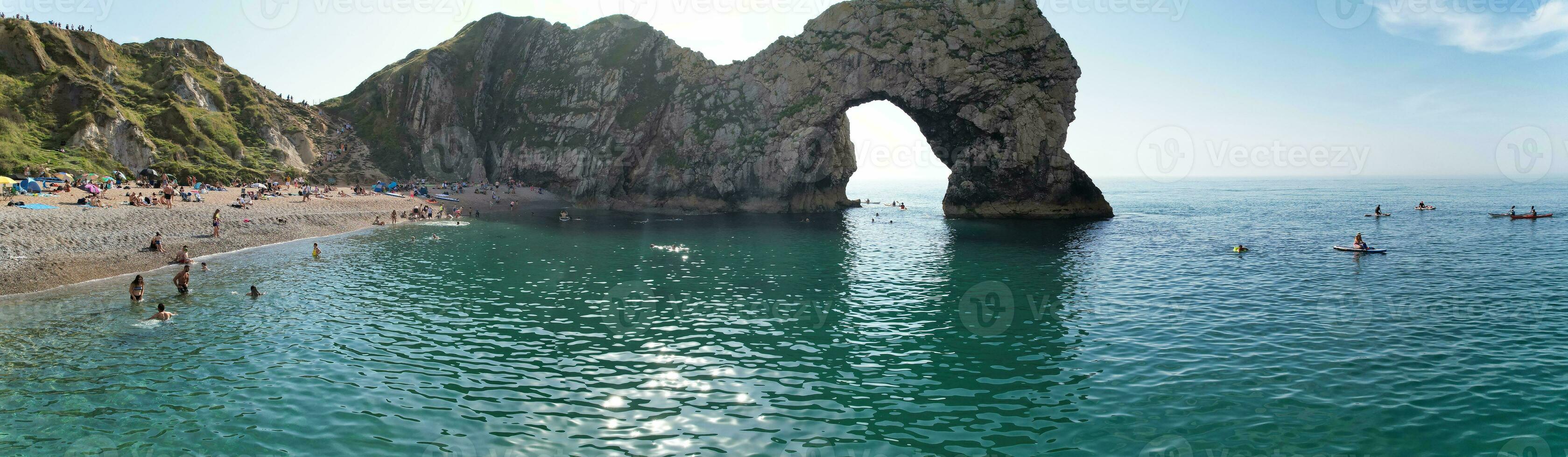 Most Beautiful High Angle View of British Landscape and Sea View of Durdle Door Beach of England Great Britain, UK. Image Was captured with Drone's camera on September 9th, 2023 photo