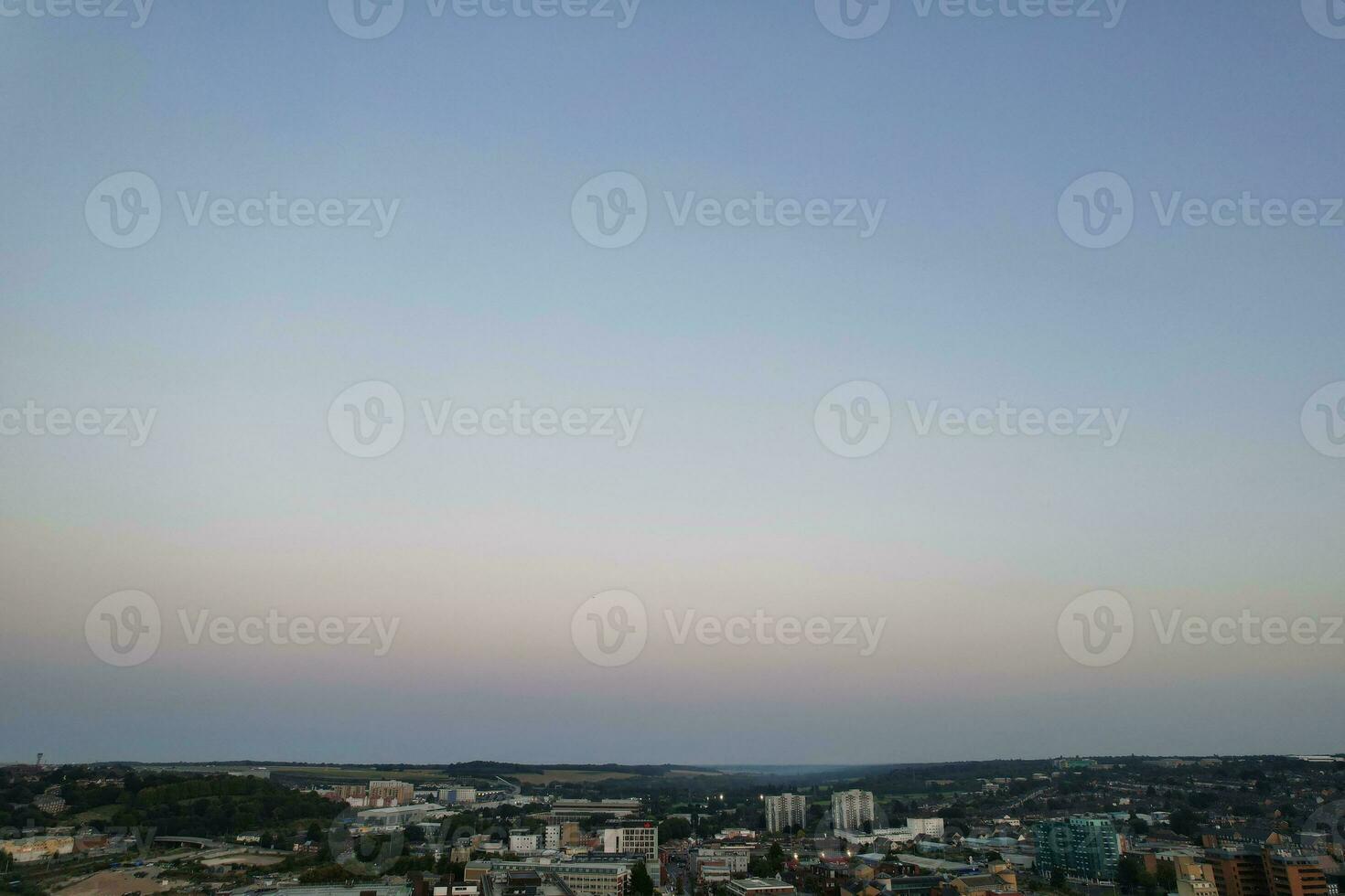 Aerial View of Illuminated Downtown Buildings, Roads and Central Luton City of England UK at Beginning of Clear Weather Night of September 5th, 2023 photo