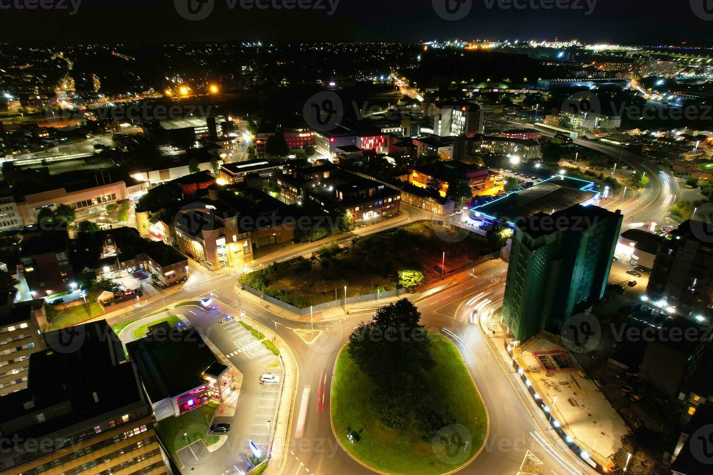 Aerial View of Illuminated Downtown Buildings, Roads and Central Luton City of England UK at Beginning of Clear Weather Night of September 5th, 2023 photo