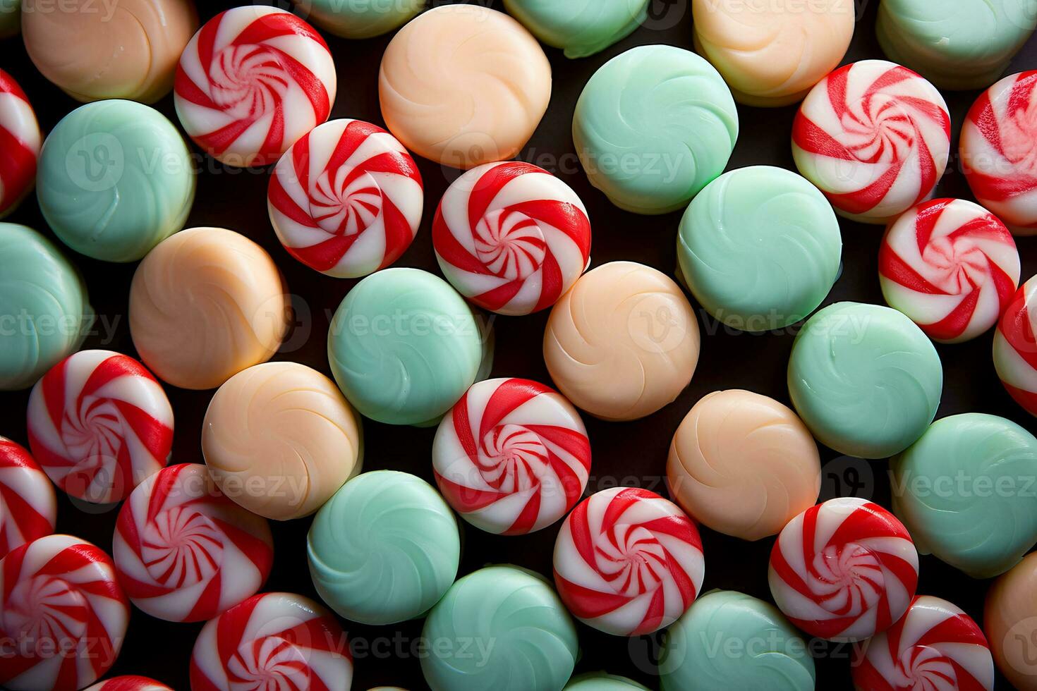 A close-up of colorful candy canes arranged in a low relief pattern against peppermint striped backgrounds photo