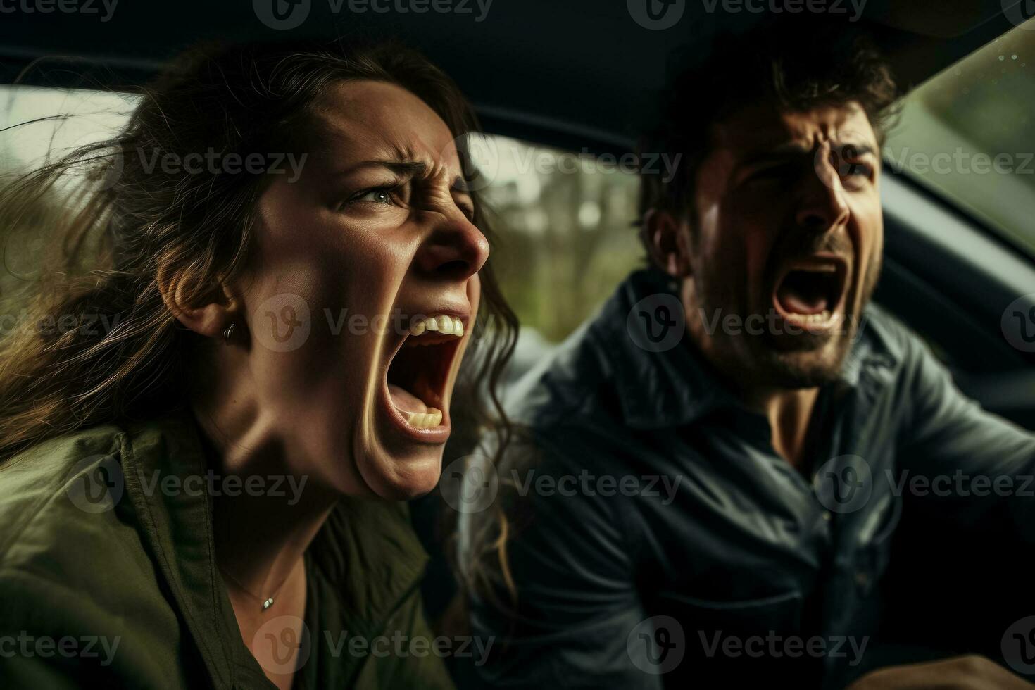 A close-up of two frustrated drivers one male and one female yelling at each other through car windows photo