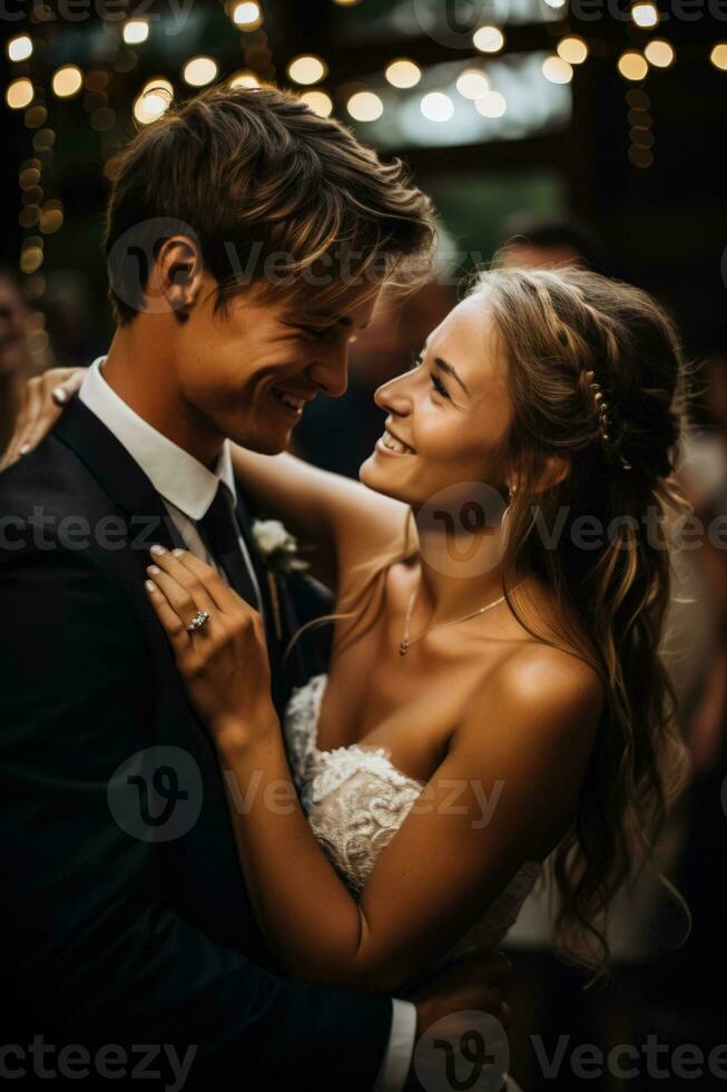 Elegant bride and groom gracefully share their first dance under twinkling fairy lights photo