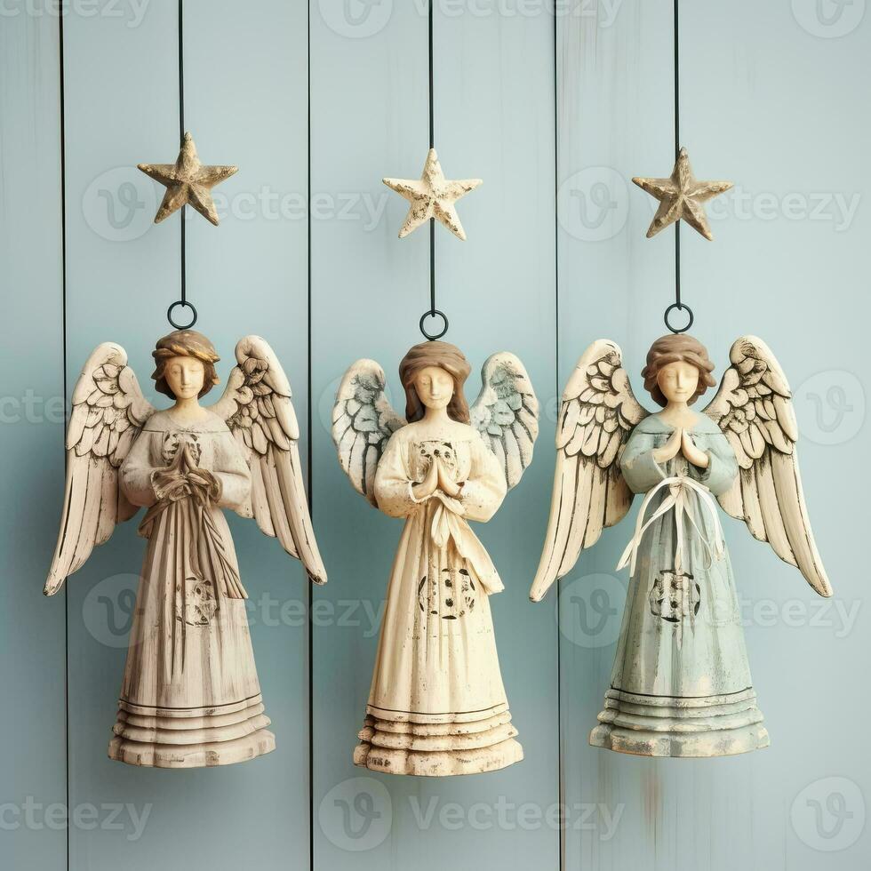 Age-old angel ornaments made from weathered wood delicately positioned isolated on a heavenly white to blue gradient background photo