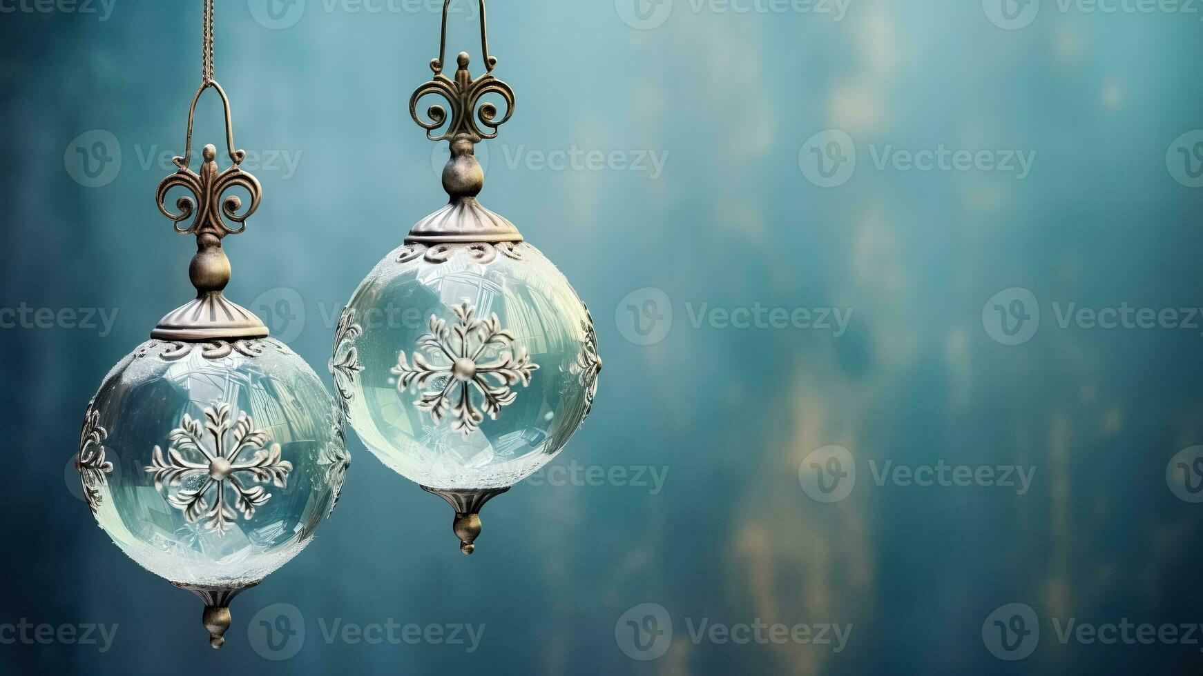 Antique glass ball ornaments kissed with frost hanging isolated on a dusky blue to icy white gradient background photo