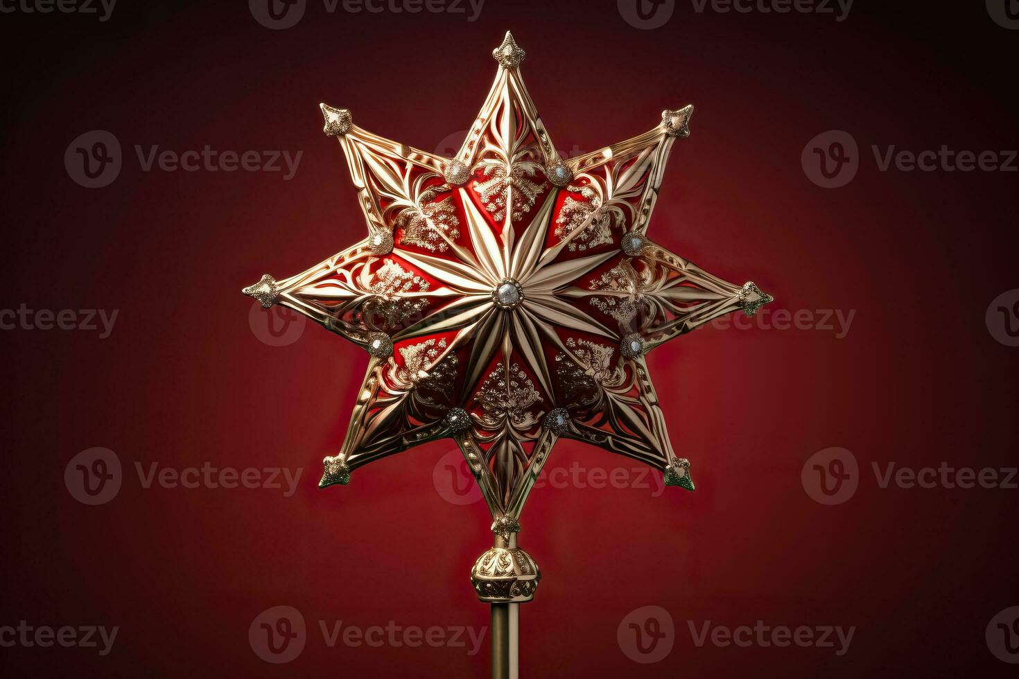 Victorian style Christmas tree topper a golden star gleaming with sparkle isolated on a holiday red gradient background photo