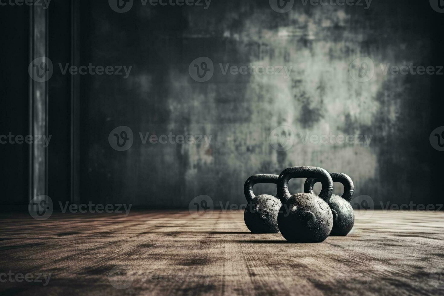 Kettlebells and dumbbells on gym floor background with empty space for text photo
