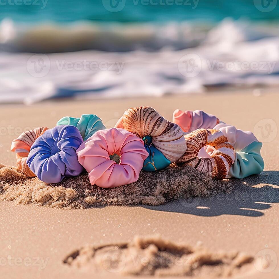 Set of colourful hairbands on the sand near the beach photo