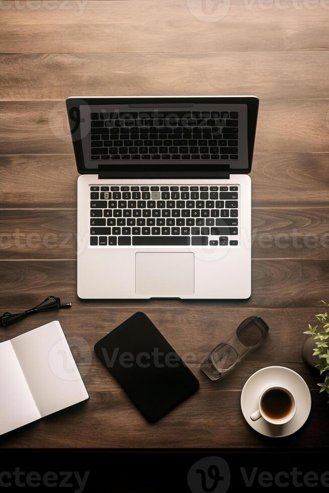 Neatly arranged workspace with a modern laptop and stationary, offering abundant copy space photo