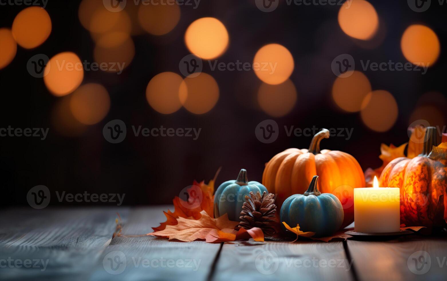 Autumn Still Life composition with pumpkins, candles, maple leaves and pine cone on dark bokeh lights blue background with copy space. Wooden table. Halloween concept. photo