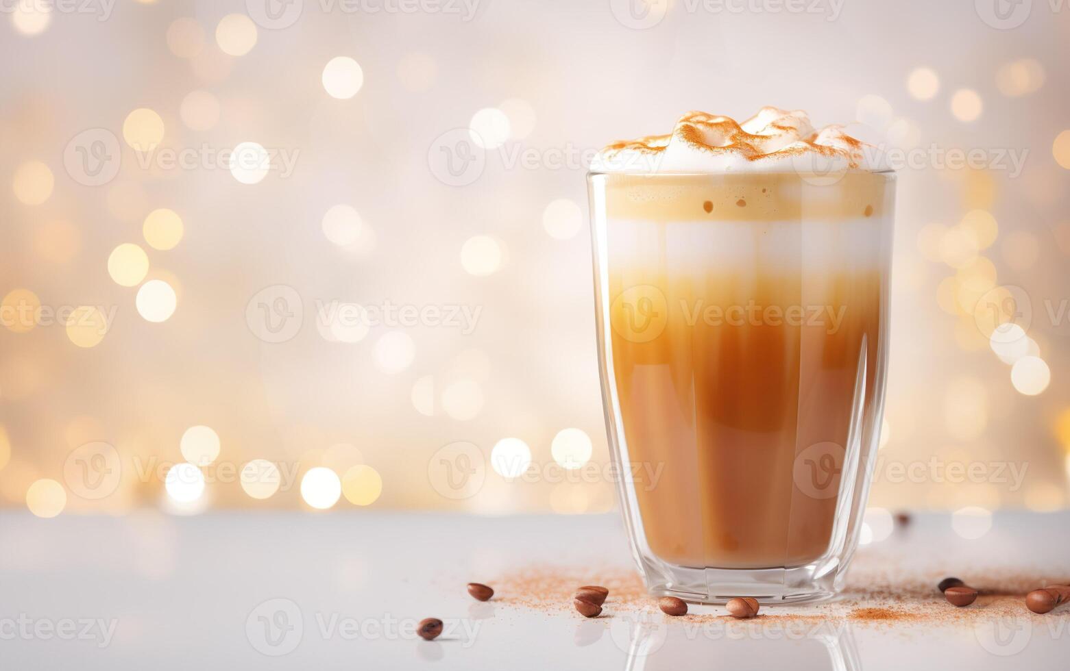 tall cup of latte and whipped cream, blurred, sparkling and fabulous white background with beautiful bokeh, light orange gold, coffee beans and cinnamon powder on the marble table. photo