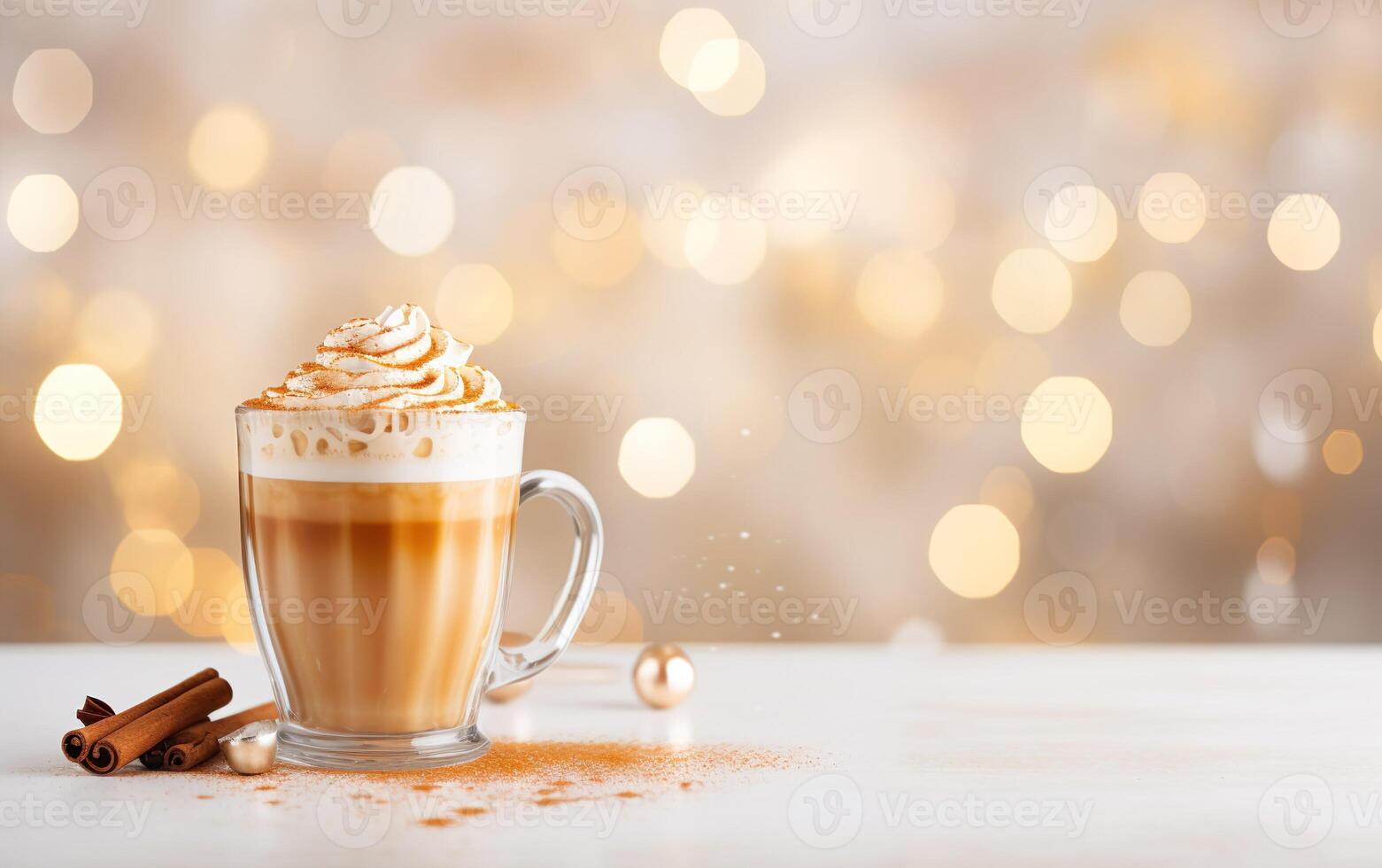 cup of latte with cinnamon and whipped cream, blurred, sparkling and fabulous white background with beautiful bokeh, light orange gold, festive atmosphere, glitter on the table. photo